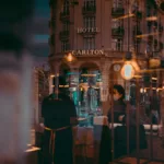 a reflection of a building in a window