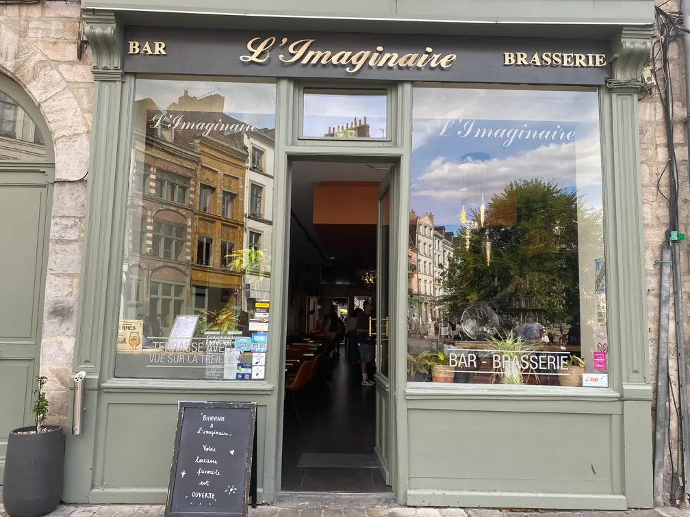 Front entrance of L'Imaginaire brasserie and terrace in the historic centre of Lille.