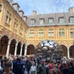 The courtyard of Lille's historic Vieille Bourse becomes one of the busiest meeting points during the Braderie.