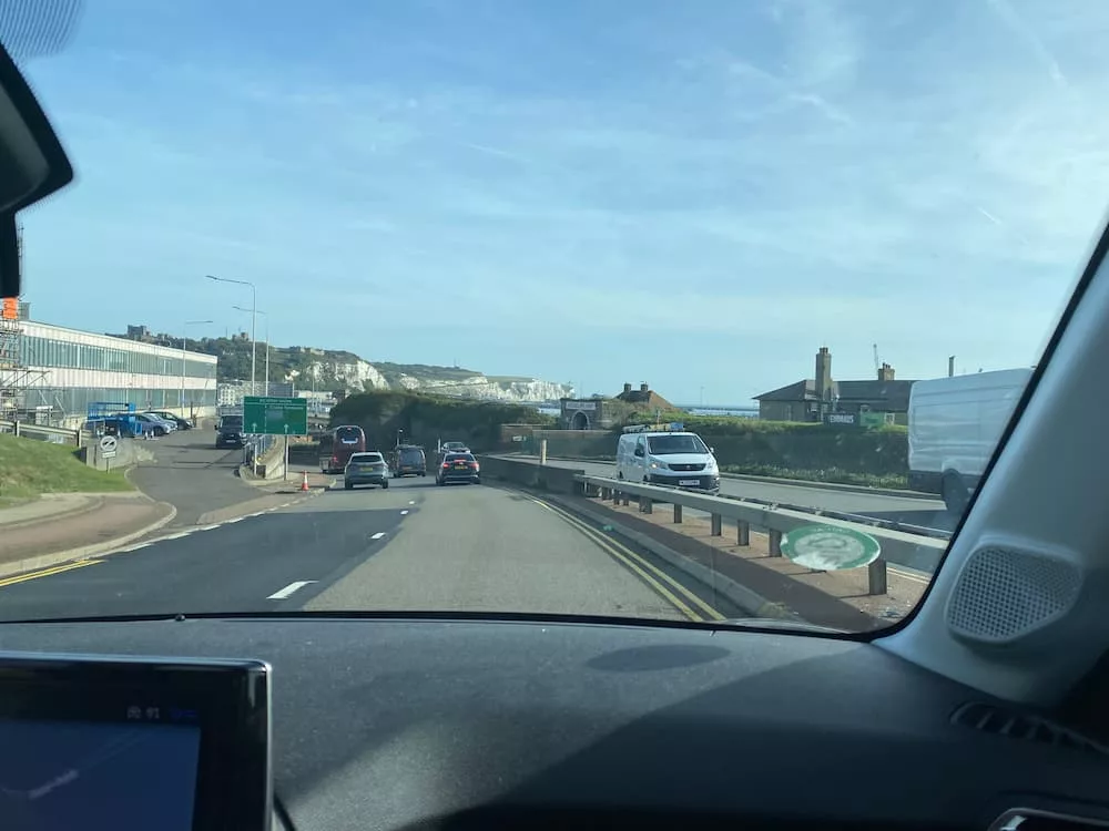 View from our electric car on the approach to the port of Dover, with the white cliffs and Dover Castle ahead
