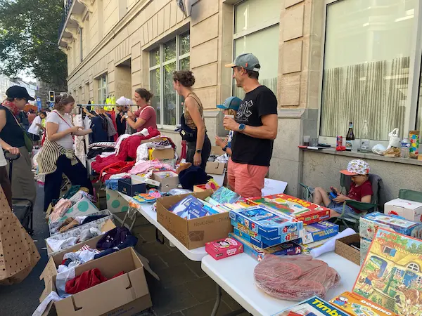 Second-hand toys, clothes and board games on a family stall at the Lille Braderie