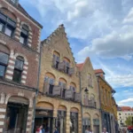 Historic Flemish-style façades with stepped gables and brickwork in Old Lille, reflecting the city's architectural heritage.