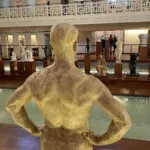 Interior of La Piscine Museum in Roubaix, with sculptures surrounding the former Art Deco swimming pool.